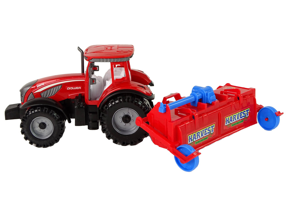 Roter Traktor mit Pflug Friktionsantrieb