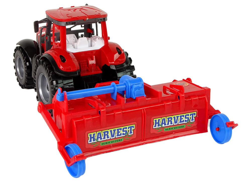 Roter Traktor mit Pflug Friktionsantrieb