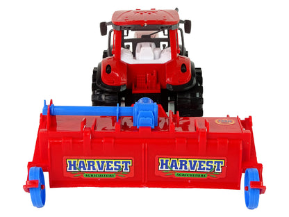 Roter Traktor mit Pflug Friktionsantrieb