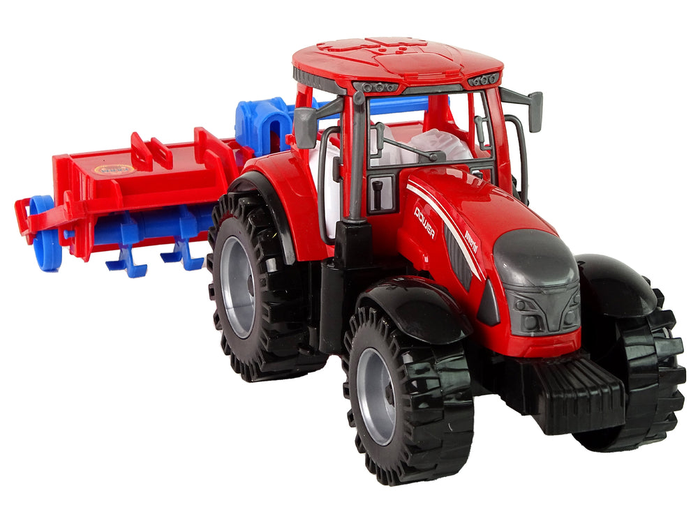 Roter Traktor mit Pflug Friktionsantrieb